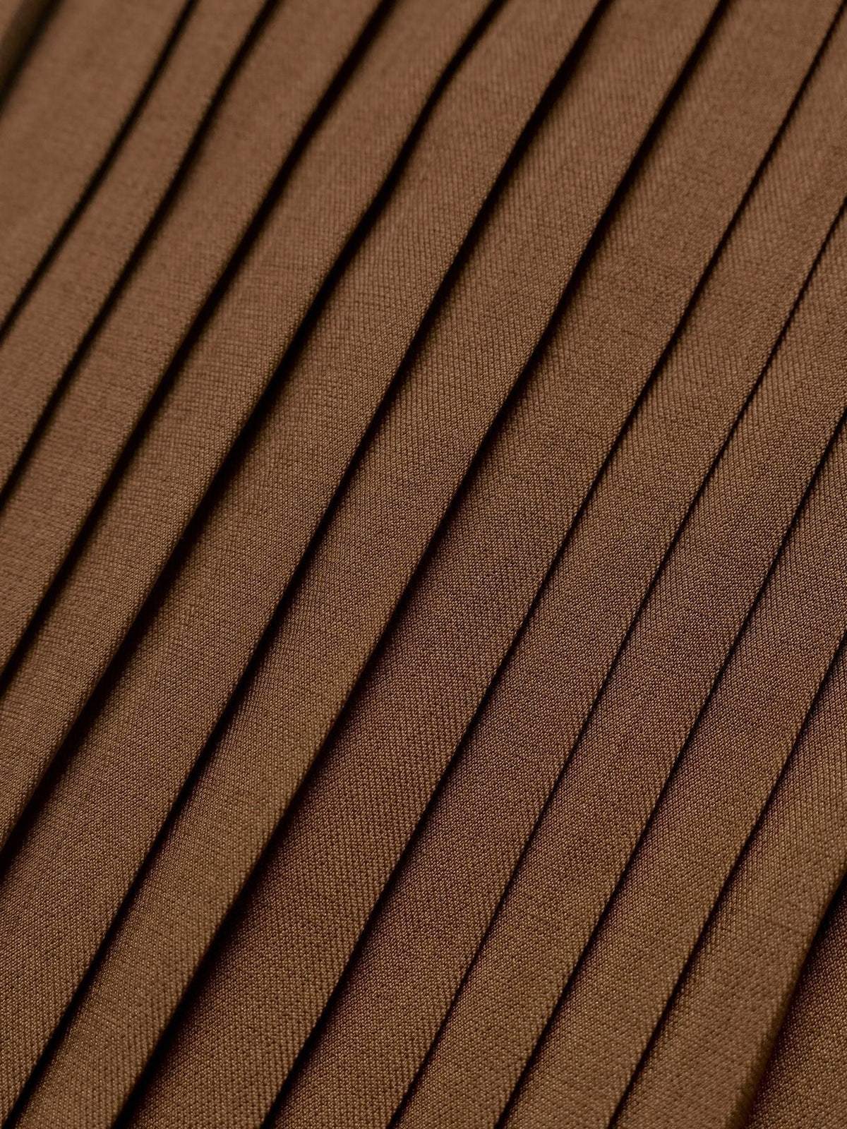 Margo & Main chocolate velvet midi dress — close-up of the knife pleats on the midi skirt