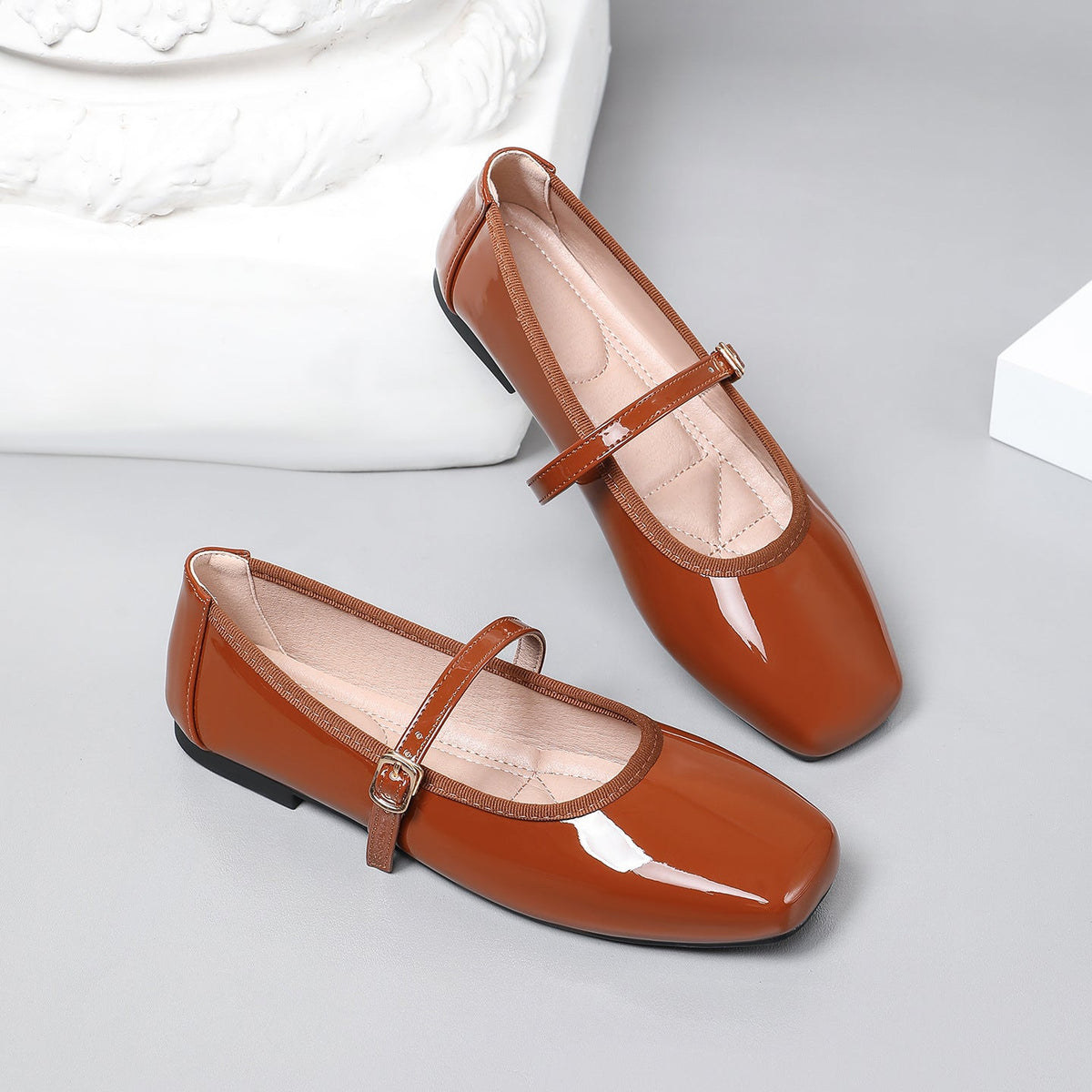 Moncelia brown patent square toe Mary Jane flats, pair shown from the side, women's sizes 5 to 12