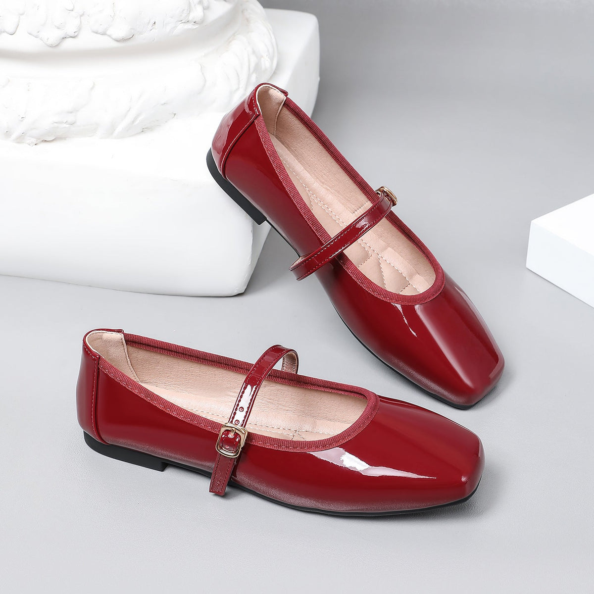 Moncelia burgundy patent square toe Mary Jane flats, pair shown from the side, women's sizes 5 to 12
