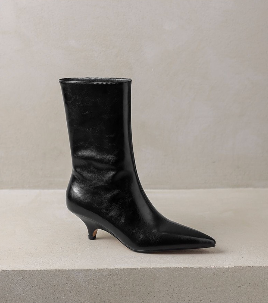 Moncelia black kitten heel ankle boots, boot in profile showing raw-edge shaft, women's sizes 5 to 11.5