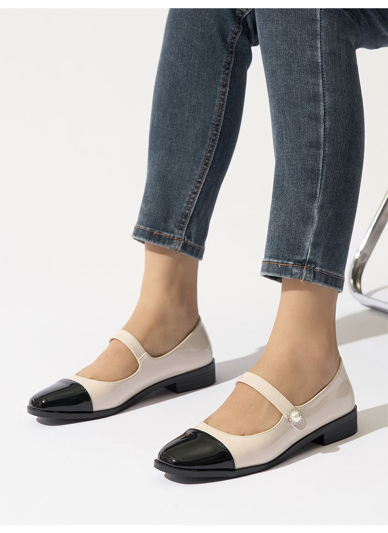 Moncelia ivory cap toe pearl button Mary Janes, front view on model with jeans, women's sizes 5 to 12