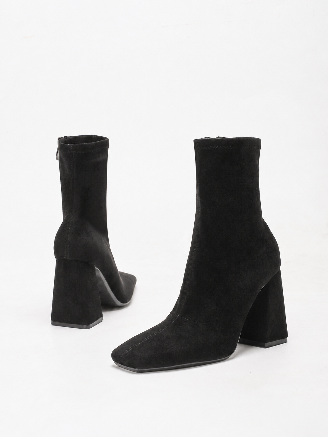Moncelia black suede square toe flared heel booties, back view showing flared heel, women's sizes 5 to 11.5