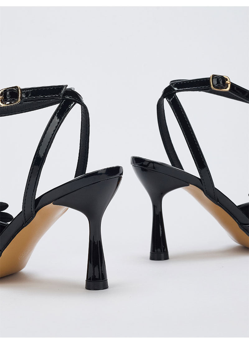 Moncelia black grosgrain bow ankle strap pumps, back view showing flared heel, women's sizes 5 to 10.5