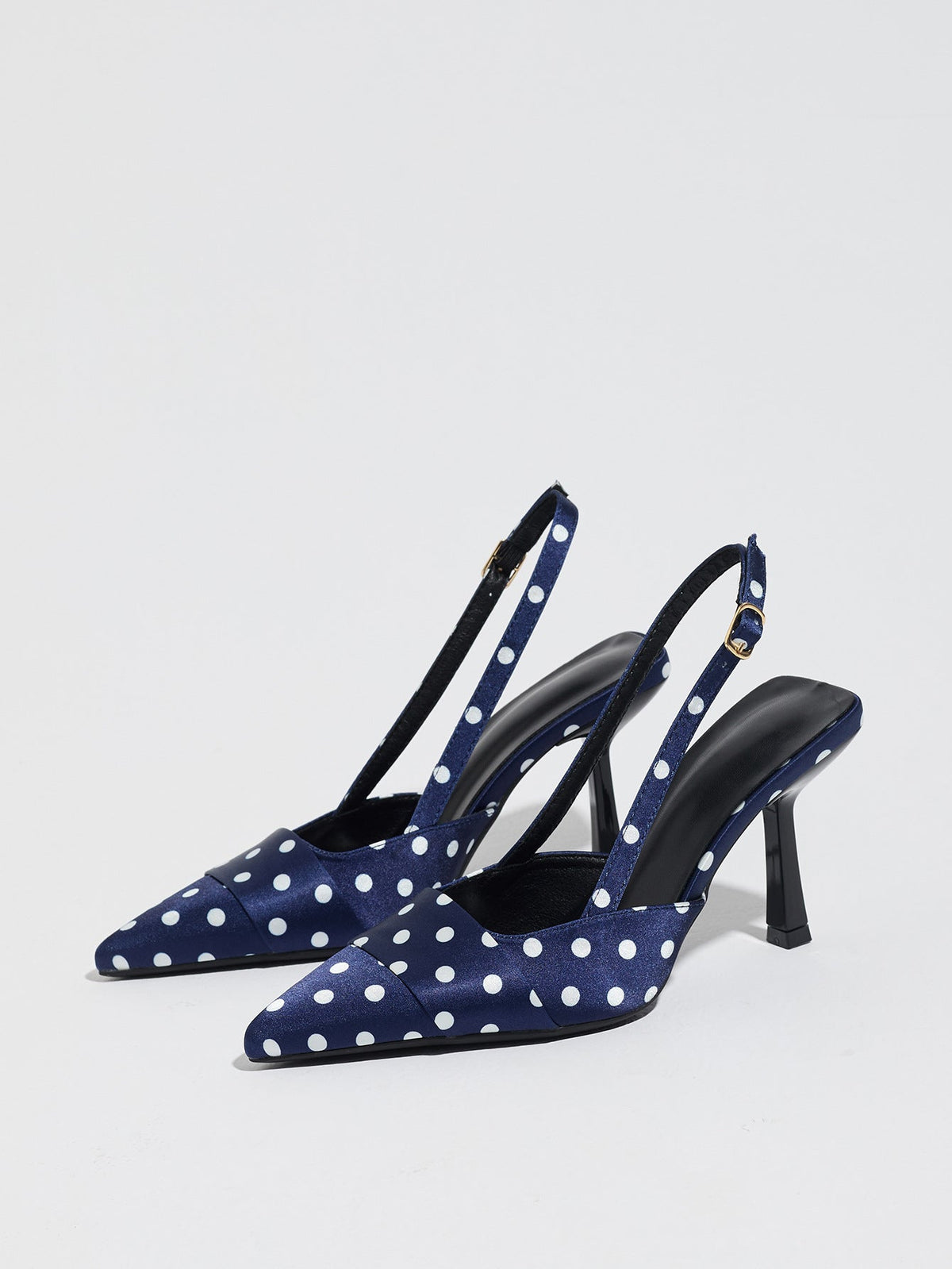 Moncelia navy polka dot satin slingbacks, pair shown from the side with white dots, women's sizes 5 to 12