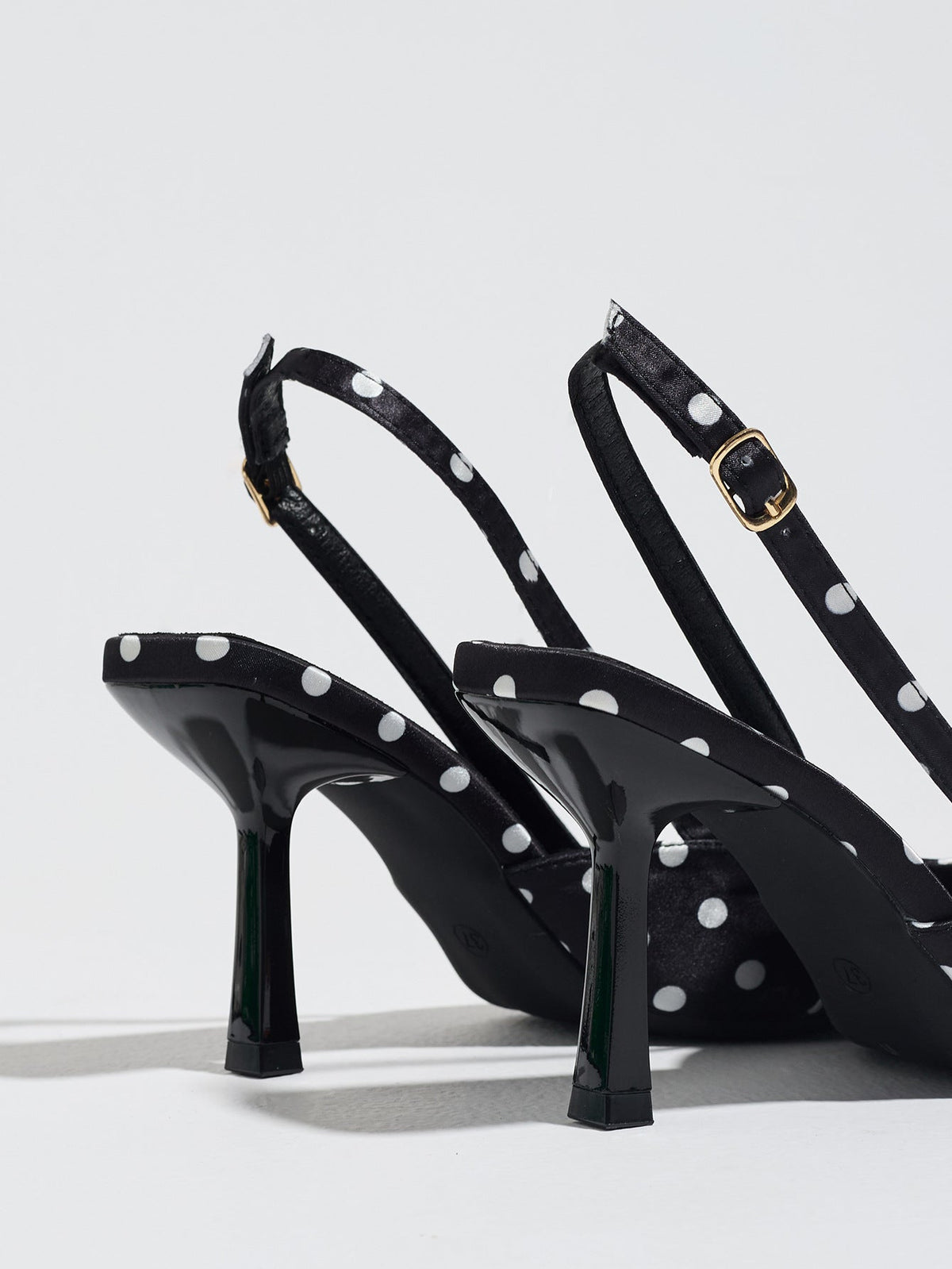 Moncelia black polka dot satin slingbacks, back view showing heels and buckled straps, women's sizes 5 to 12