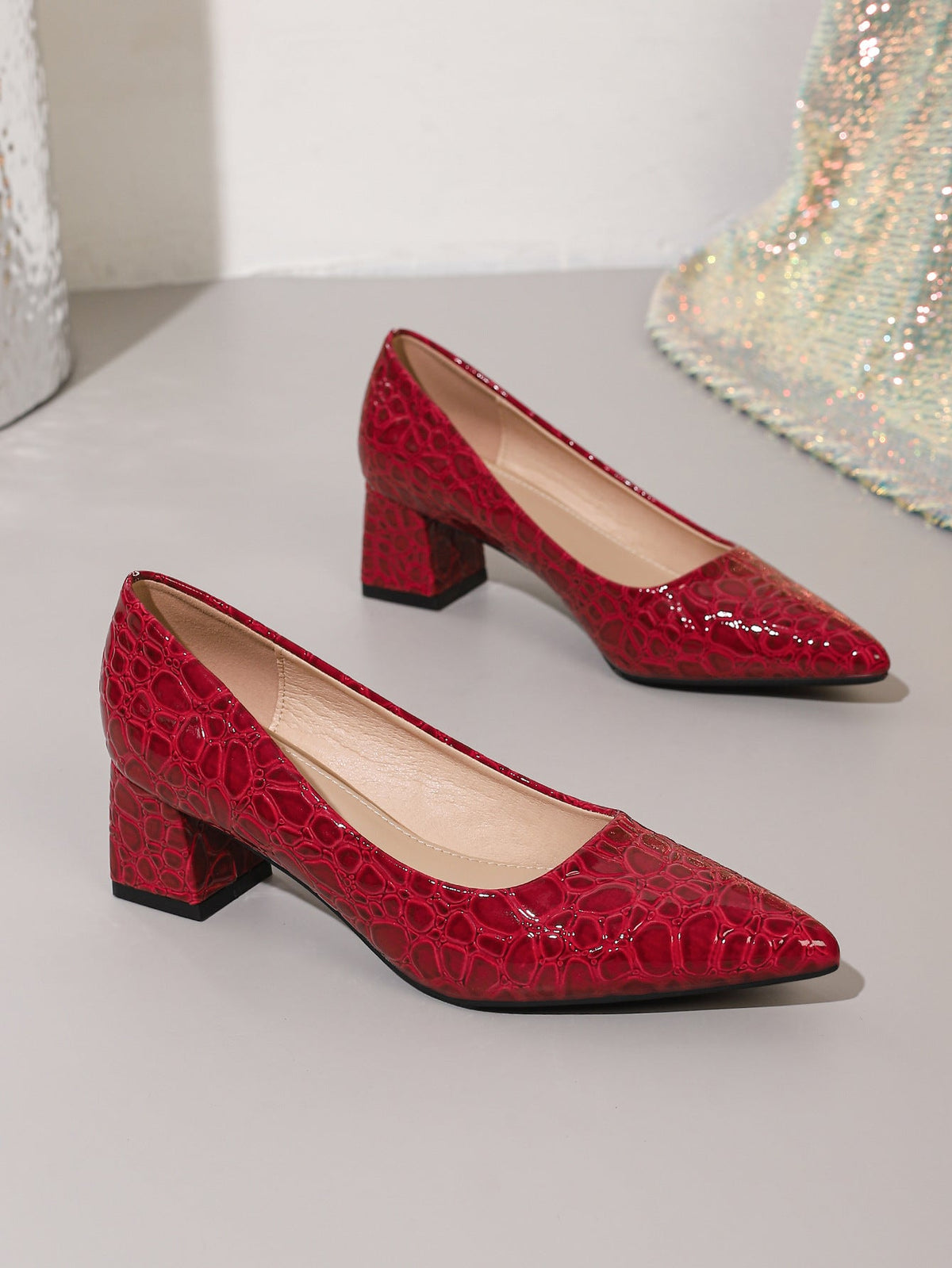 Moncelia burgundy croc-embossed block heel pumps, pair shown from the side, women's sizes 5.5 to 12
