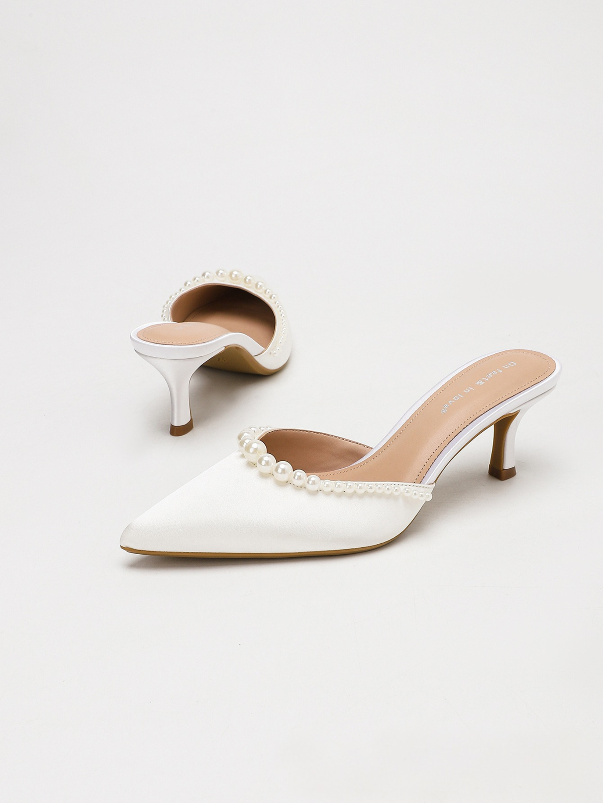 Moncelia ivory pearl trim satin mules, pair showing pointed toe and open back, women's sizes 5 to 11.5