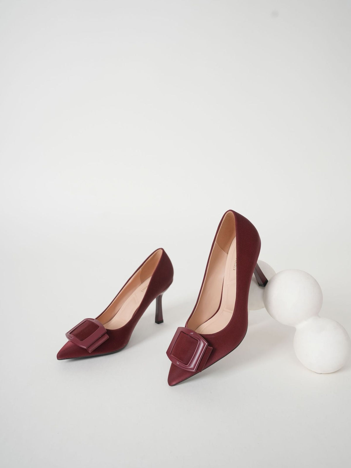 Moncelia burgundy folded plate pointed toe pumps, pair shown from the front, women's sizes 5.5 to 10.5
