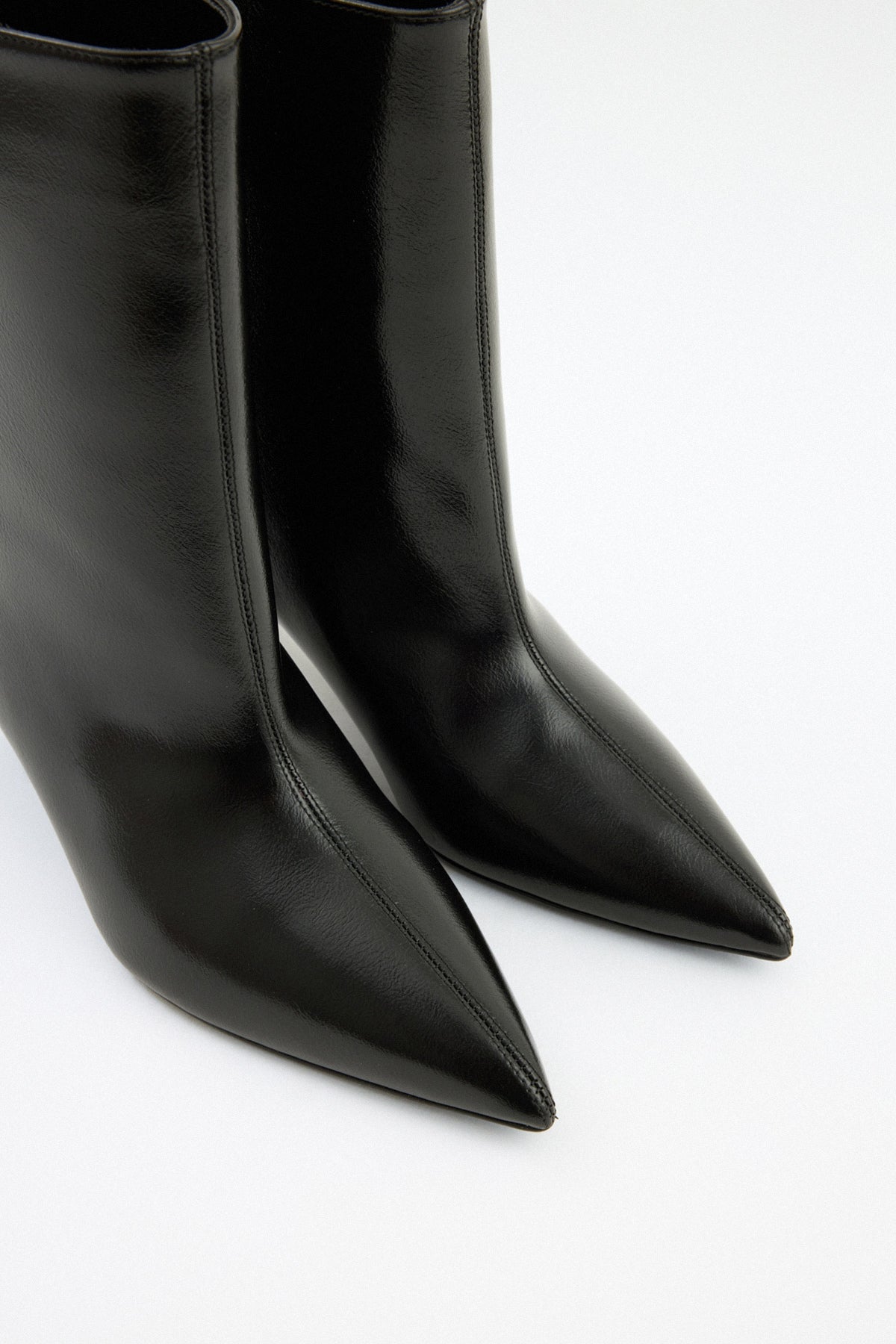 Moncelia black pointed toe kitten heel booties, close-up of pull-on shaft and toe, women's sizes 5 to 12