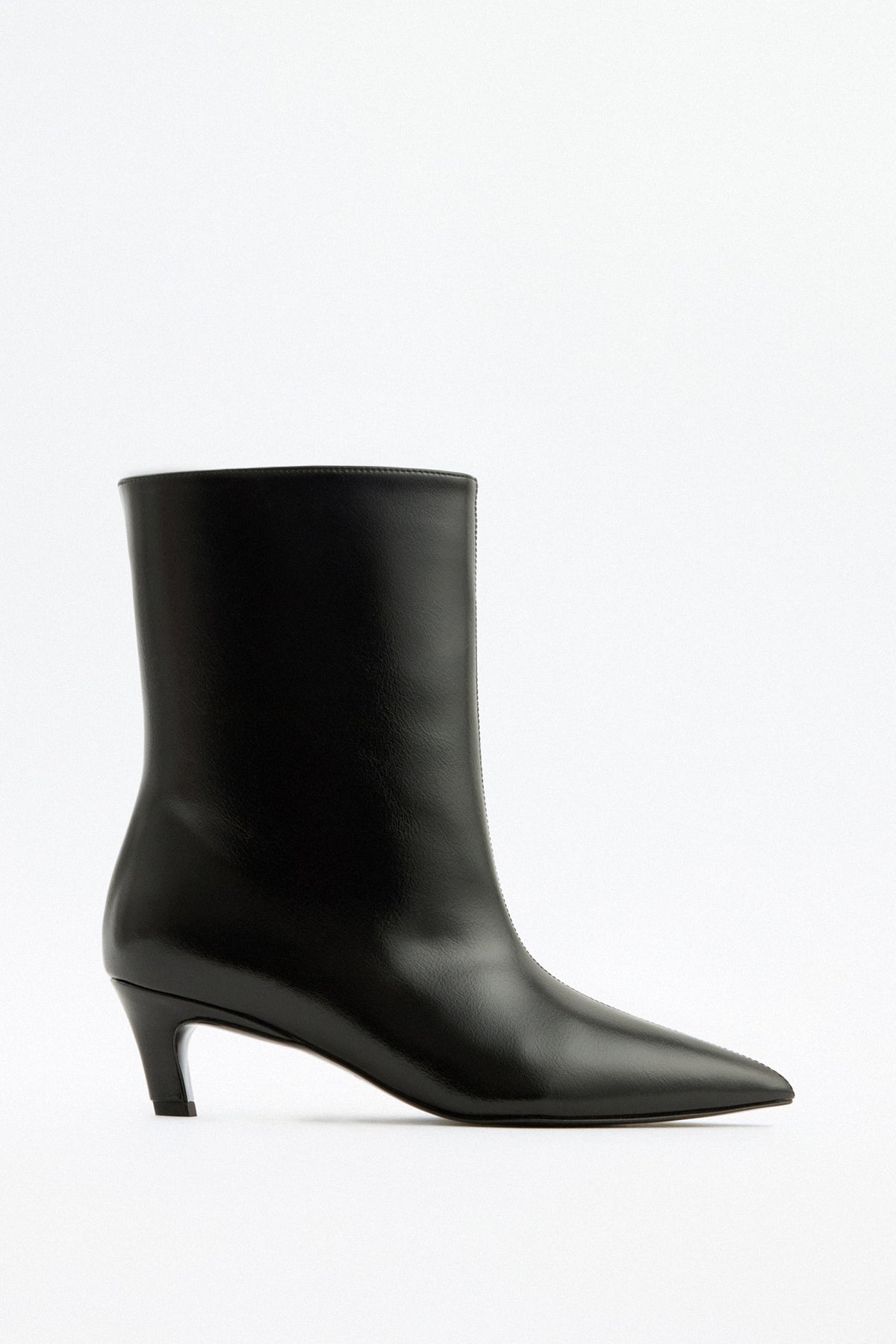 Moncelia black pointed toe kitten heel booties, single bootie in profile showing heel, women's sizes 5 to 12