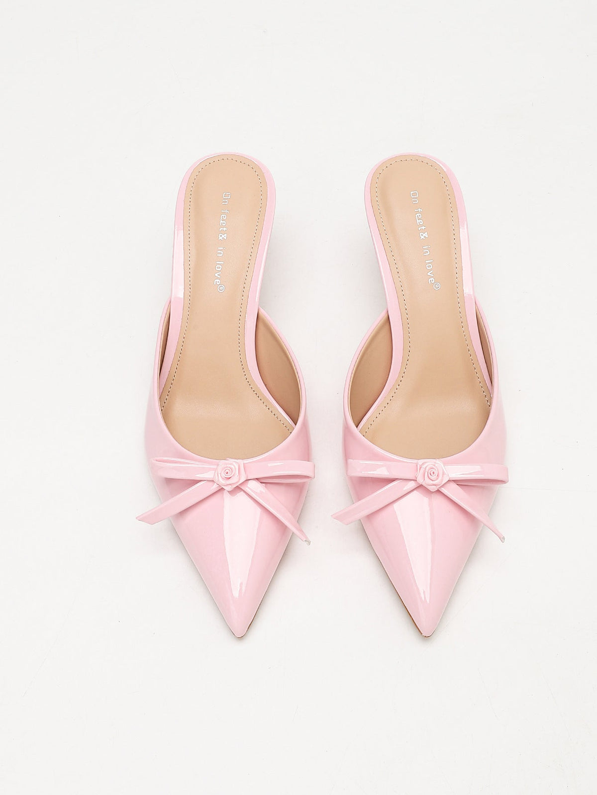 Moncelia pink bow pointed toe curved heel mules, pair shown from above showing bows, women's sizes 5 to 11.5