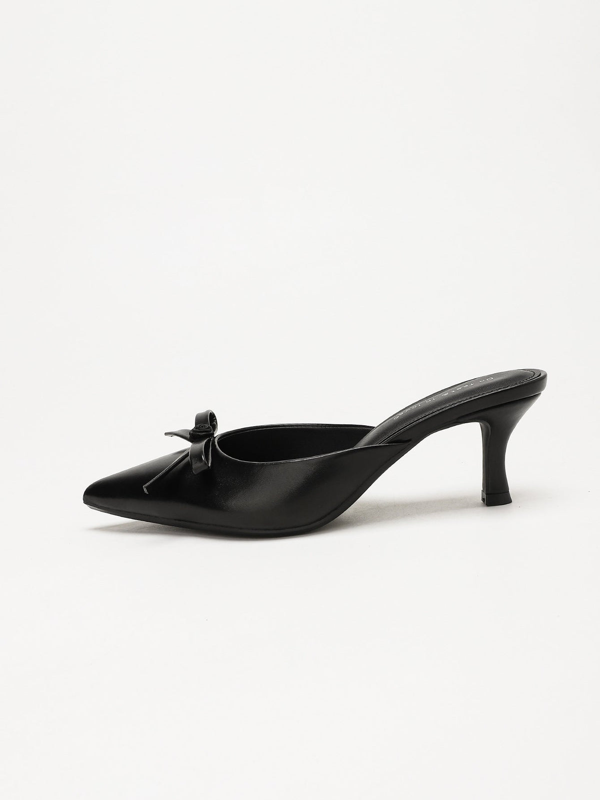 Moncelia black bow pointed toe curved heel mules, single mule in profile showing heel, women's sizes 5 to 11.5