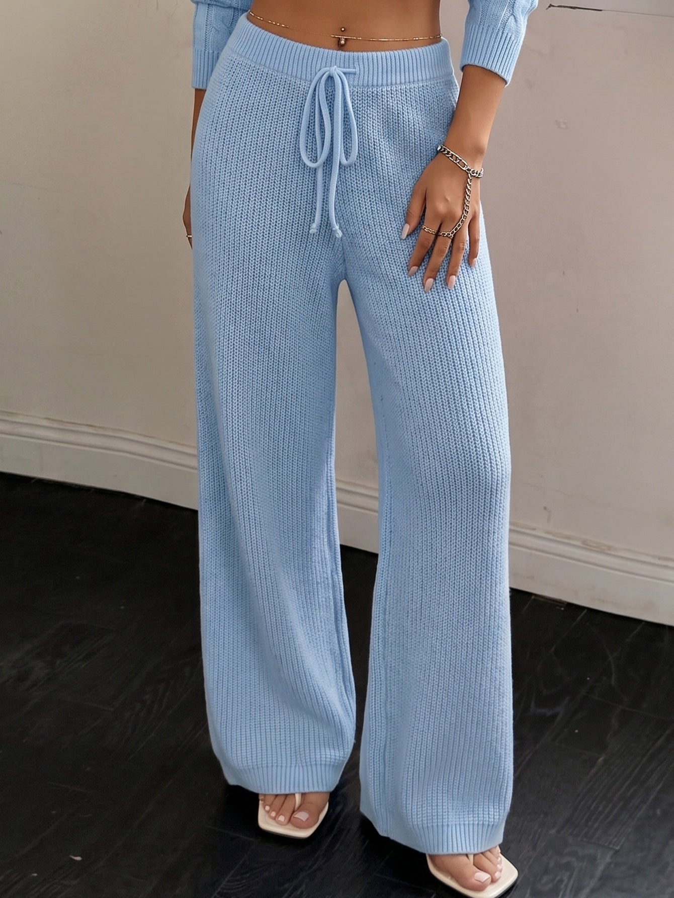 Woman wearing ribbed knit wide-leg trousers for a fall office outfit
