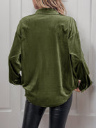 Margo & Main green velvet button-front shirt — back view of the curved hem and long sleeves