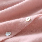 Moncelia Noemie Asymmetric Button Knit Sweater