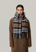 Margo & Main camel brushed plaid wool scarf — front view wrapped high, ends hanging down