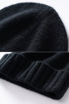 Margo & Main black ribbed cashmere fisherman beanie — close-up of the knit crown and folded ribbed cuff
