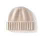 Margo & Main ivory ribbed cashmere fisherman beanie — angled view of the folded ribbed cuff and crown