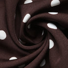 Margo & Main brown polka dot maxi dress — close-up of the white dots on the brown fabric