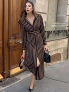 Margo & Main brown striped shirt midi dress — walking view of the button front and side slit