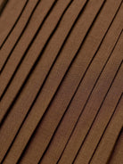Margo & Main chocolate velvet midi dress — close-up of the knife pleats on the midi skirt