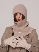 Margo & Main beige wool beanie and snood set — front view styled with a wool coat and gloves