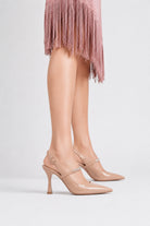 Moncelia beige crystal strap slingback pumps, side view on model standing, women's sizes 4.5 to 9.5
