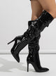 Moncelia black ruched patent knee-high boots, side view on model showing stiletto, women's sizes 5 to 11.5