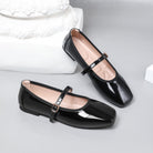 Moncelia black patent square toe Mary Jane flats, pair shown from the side, women's sizes 5 to 12