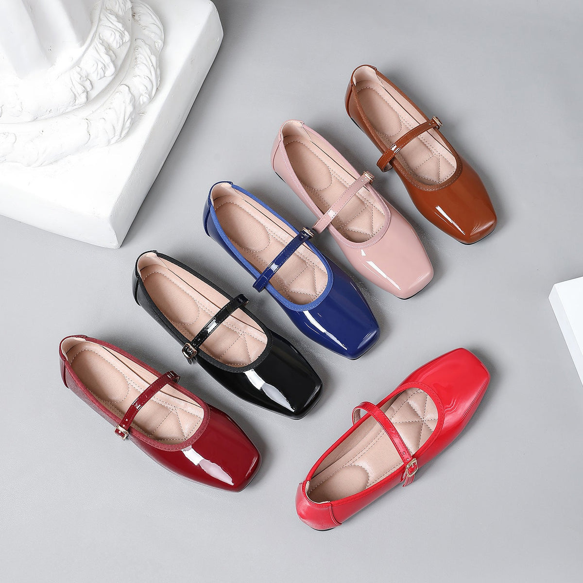 Moncelia patent square toe Mary Jane flats in black, pink, red and brown side by side, women's sizes 5 to 12