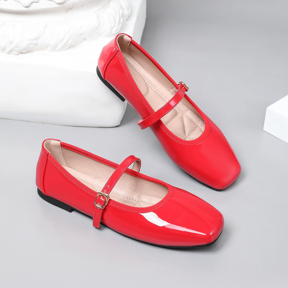Moncelia red patent square toe Mary Jane flats, pair shown from the side, women's sizes 5 to 12