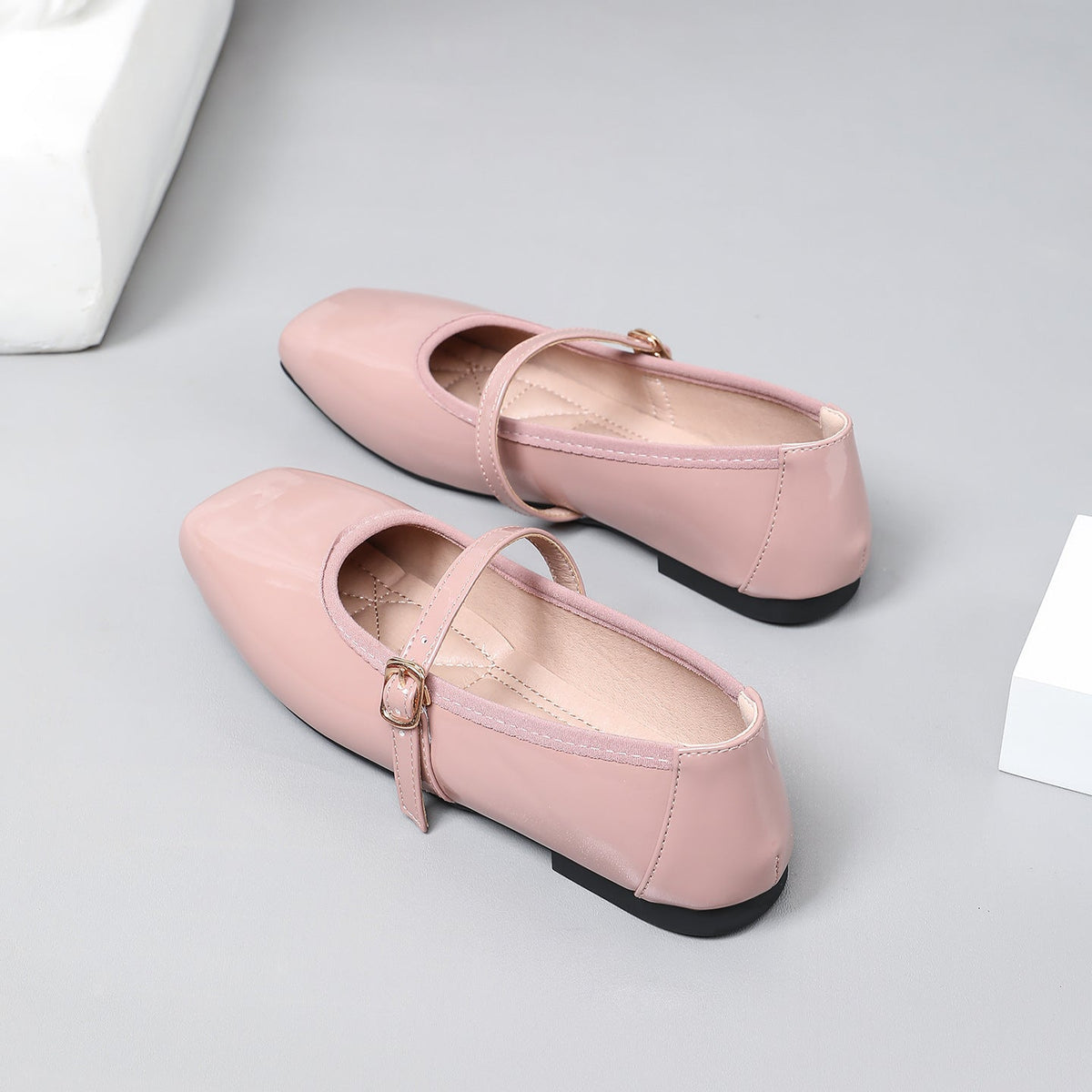 Moncelia pink patent square toe Mary Jane flats, close-up of the buckled strap, women's sizes 5 to 12