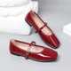 Moncelia burgundy patent square toe Mary Jane flats, pair shown from the side, women's sizes 5 to 12