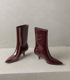 Moncelia burgundy kitten heel ankle boots, pair shown from the front, women's sizes 5 to 11.5