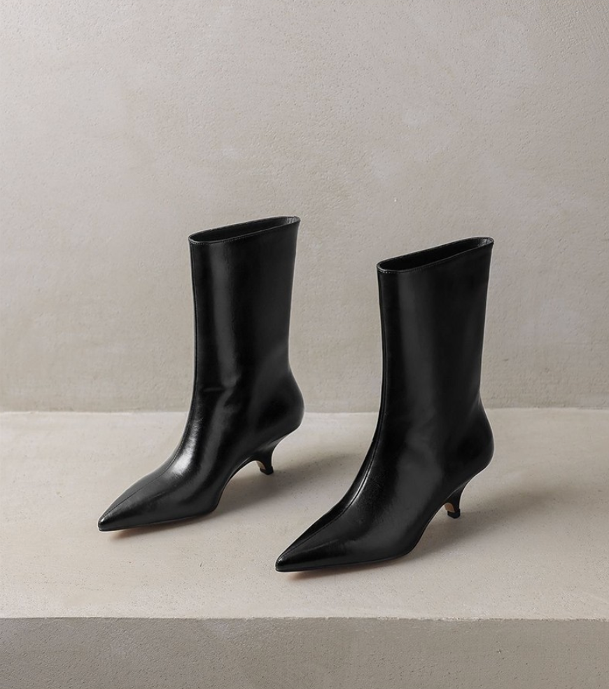 Moncelia black kitten heel ankle boots, pair showing curved kitten heels, women's sizes 5 to 11.5