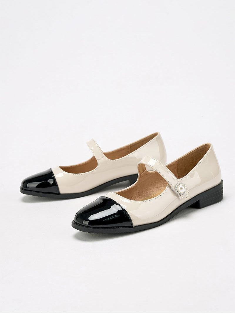 Moncelia ivory cap toe pearl button Mary Janes, pair shown from the side, women's sizes 5 to 12