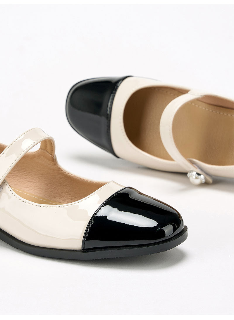 Moncelia ivory cap toe pearl button Mary Janes, close-up of the black cap toe, women's sizes 5 to 12