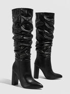 Moncelia black slouchy knee-high boots, pair shown from the side with ruched shaft, women's sizes 5.5 to 11.5