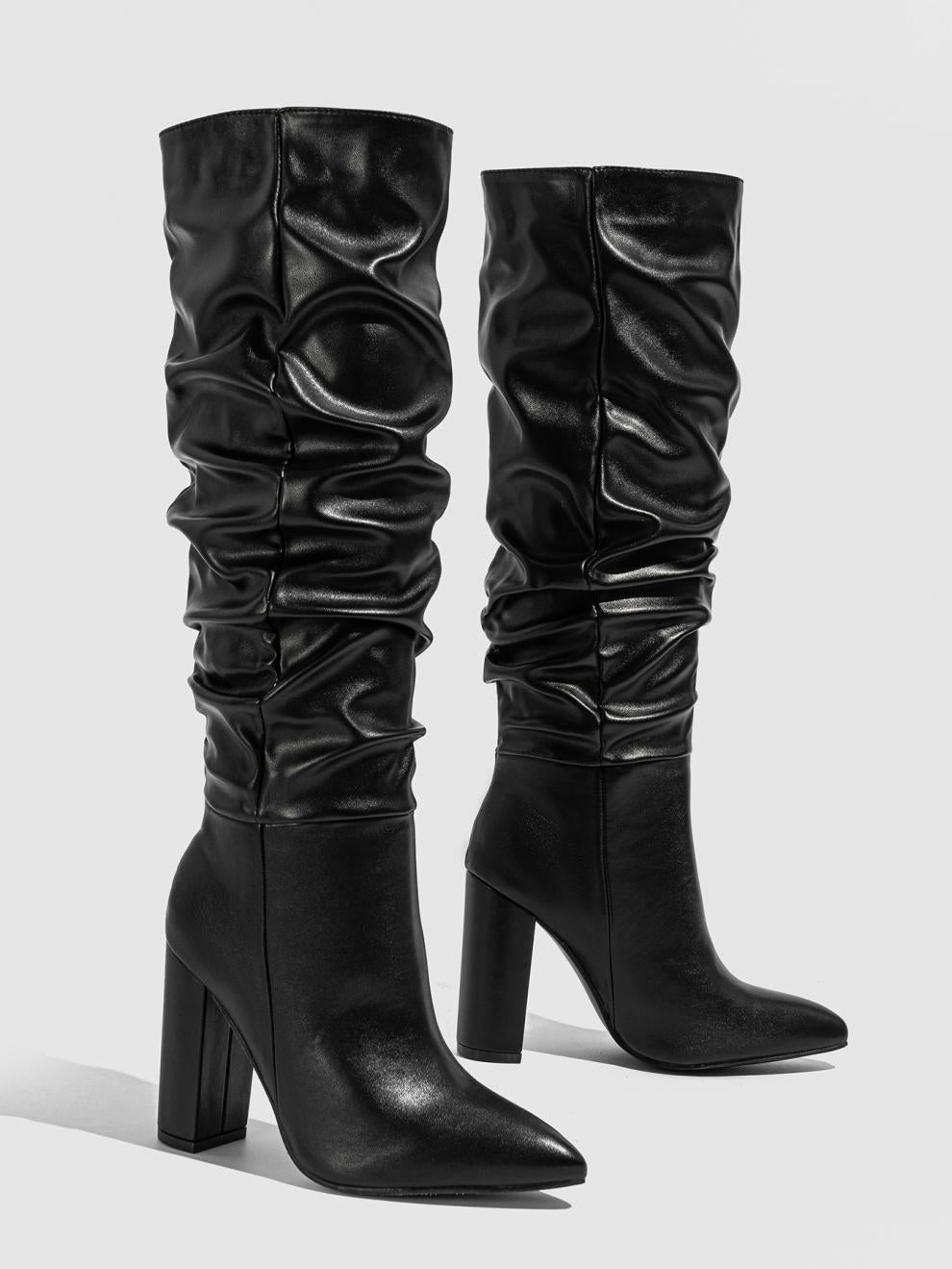 Moncelia black slouchy knee-high boots, pair shown from the side with ruched shaft, women's sizes 5.5 to 11.5