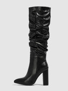 Moncelia black slouchy knee-high boots, single boot showing pointed toe, women's sizes 5.5 to 11.5