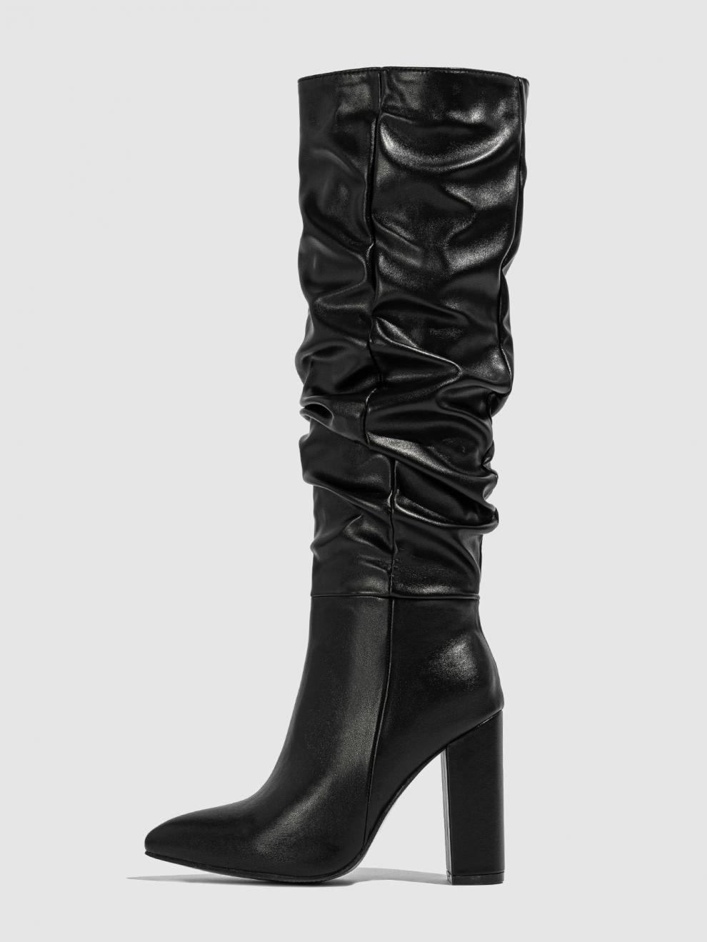Moncelia black slouchy knee-high boots, single boot showing pointed toe, women's sizes 5.5 to 11.5