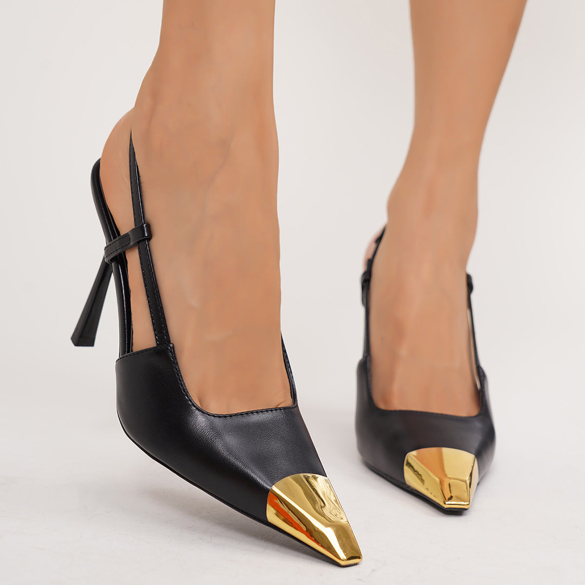 Moncelia black gold cap toe slingbacks, front view on model showing gold cap toe, women's sizes 5 to 11.5