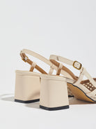 Moncelia cream woven block heel slingbacks, back view showing block heels and buckles, women's sizes 5 to 12