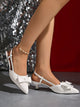 Moncelia ivory bow slingback kitten heels, front view on model showing bow, women's sizes 5 to 11.5
