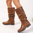 Moncelia camel slouchy pull-on mid-calf boots, side view on model with block heel, women's sizes 5.5 to 11.5