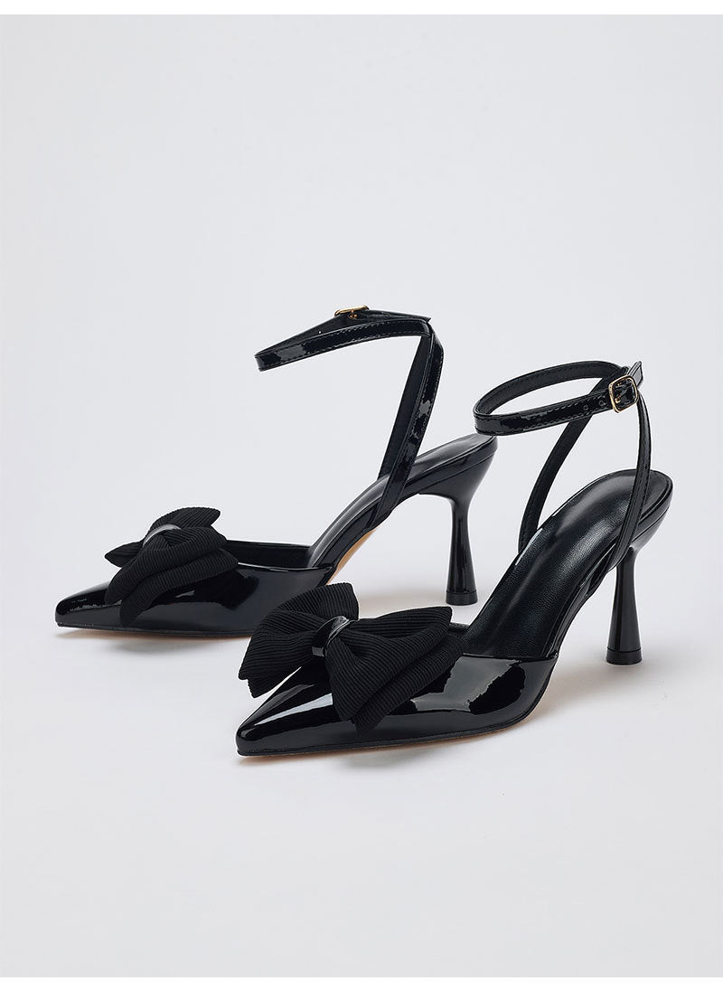 Moncelia black grosgrain bow ankle strap pumps, pair shown from the side, women's sizes 5 to 10.5