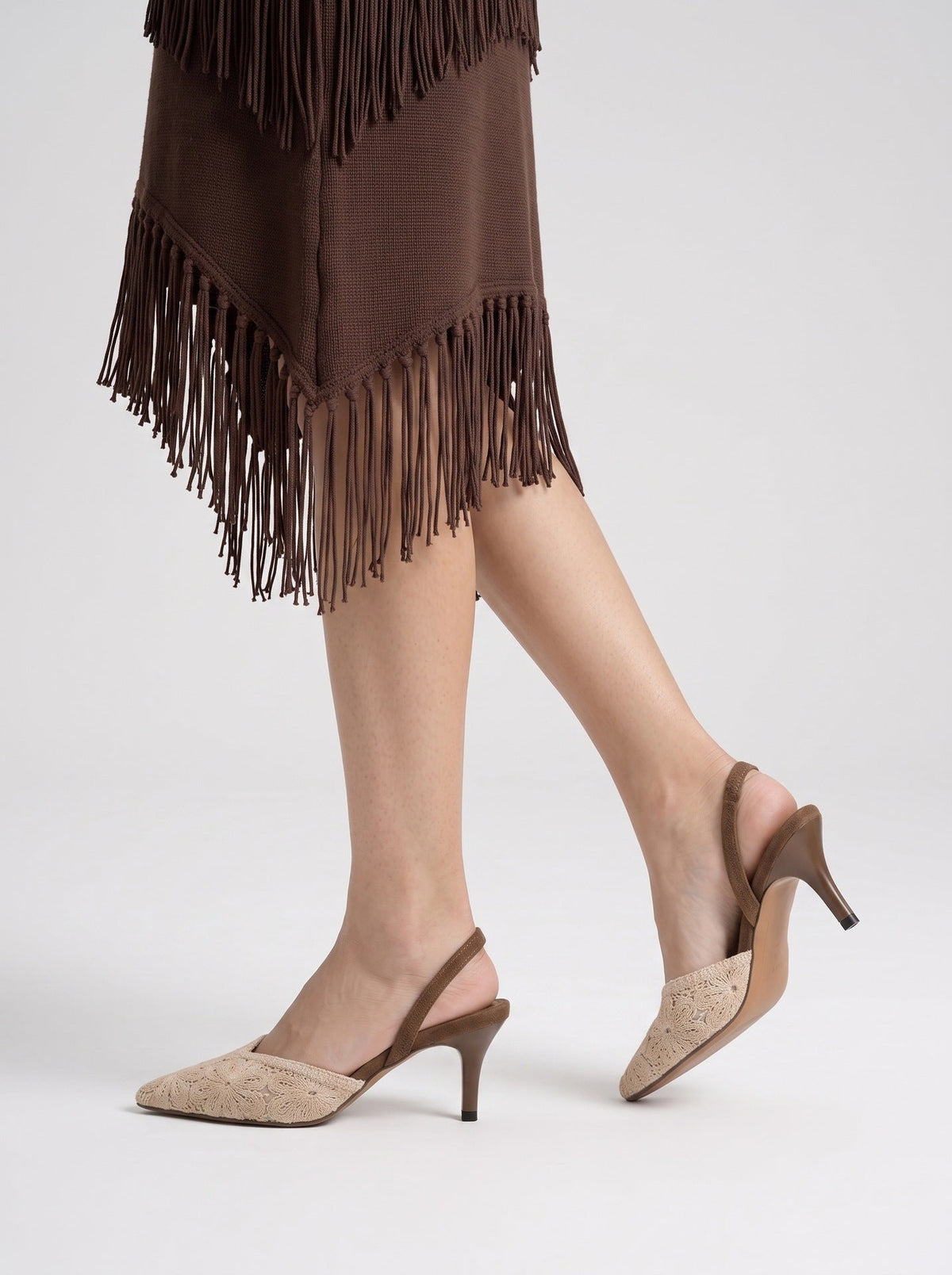 Moncelia brown crochet pointed slingback heels, side view on model walking, women's sizes 5 to 10.5