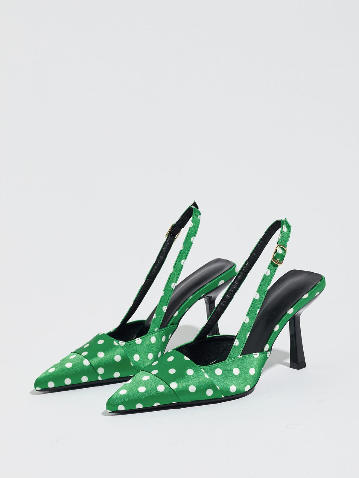 Moncelia green polka dot satin slingbacks, pair shown from the side with pointed toes, women's sizes 5 to 12