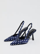 Moncelia navy polka dot satin slingbacks, pair shown from the side with white dots, women's sizes 5 to 12