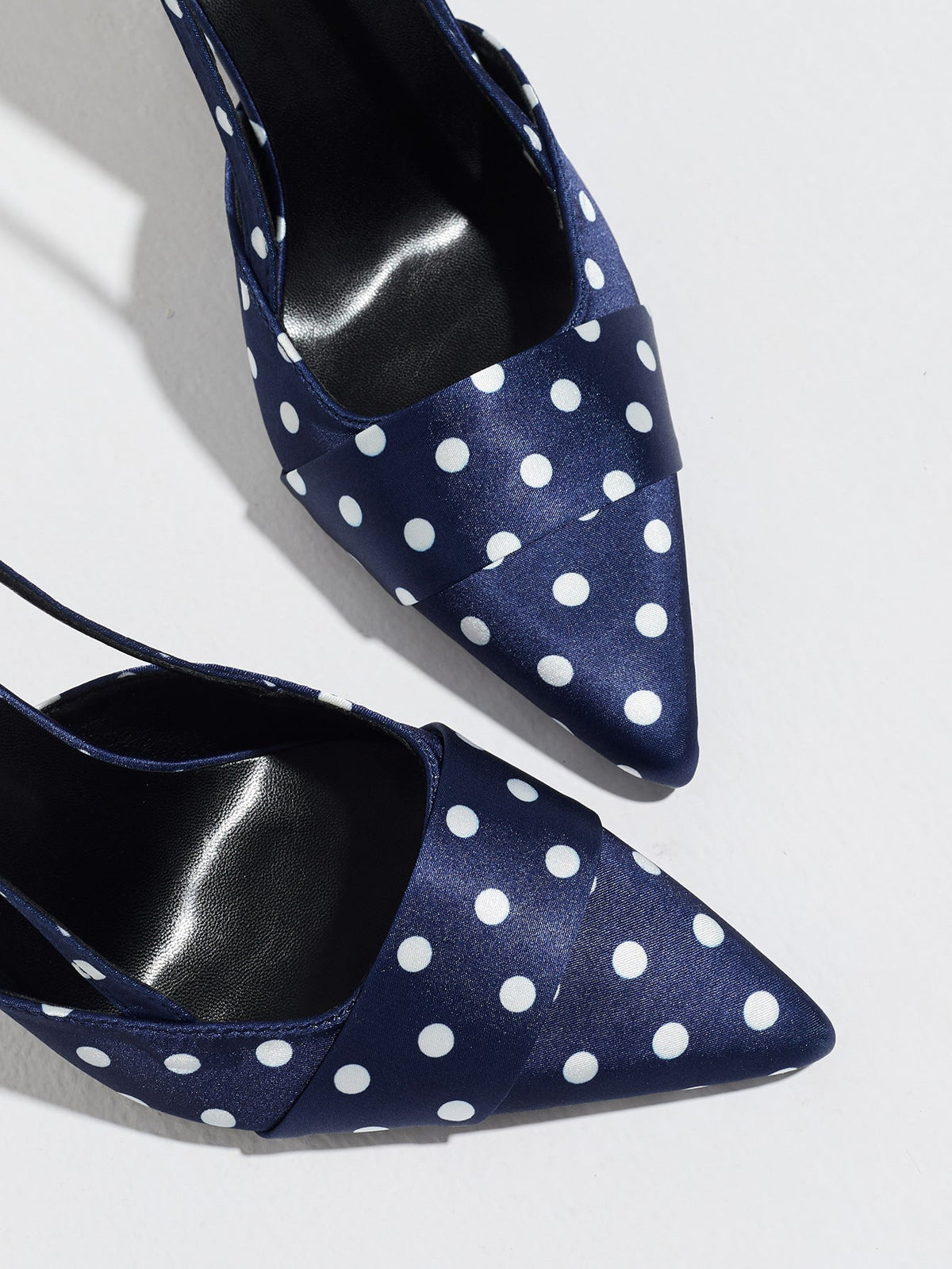 Moncelia navy polka dot satin slingbacks, close-up of pointed toe and black lining, women's sizes 5 to 12